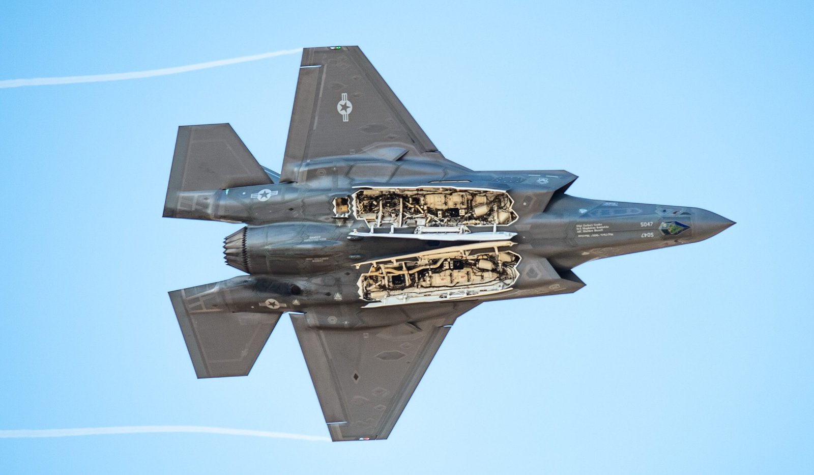 F-35 stealth fighter with open internal weapons bay.