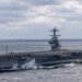 The 100,000-ton aircraft carrier PCU John F. Kennedy executing high-speed maneuvers during Atlantic sea trials 2026