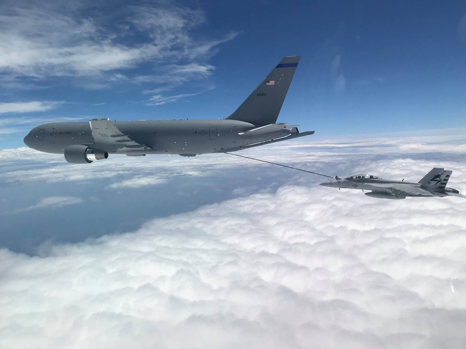 New Hampshire-based KC-46A aircrew refuel a U.S. Navy F/A-18F Super Hornet. This marked the first time the aircrew utilized the KC-46A centerline drogue system to refuel an aircraft.
