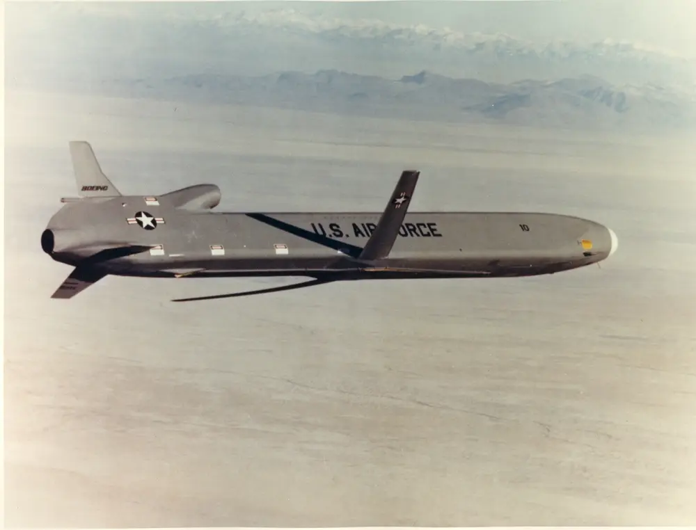 An AGM-86B Air Launched Cruise Missile captured in-flight from a chase aircraft over the White Sands Missile Range, New Mexico, during a program test flight.