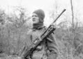 A member of British No. 9 Commando at Anzio equipped for a patrol with his Bren gun 5 March 1944.