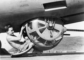 Cutaway diagram or close-up profile of a B-17 ball turret showing the fetal position of the gunner.