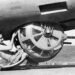 Cutaway diagram or close-up profile of a B-17 ball turret showing the fetal position of the gunner.
