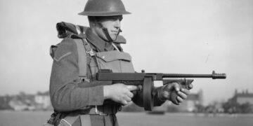 A British soldier equipped with a Thompson M1928 submachine gun in November 1940