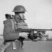 A British soldier equipped with a Thompson M1928 submachine gun in November 1940