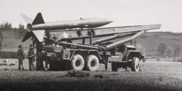 US Army launcher vehicle based on the M139D 5-ton truck. Honest John nuclear-capable rocket artillery.