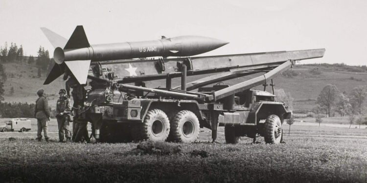 US Army launcher vehicle based on the M139D 5-ton truck. Honest John nuclear-capable rocket artillery.
