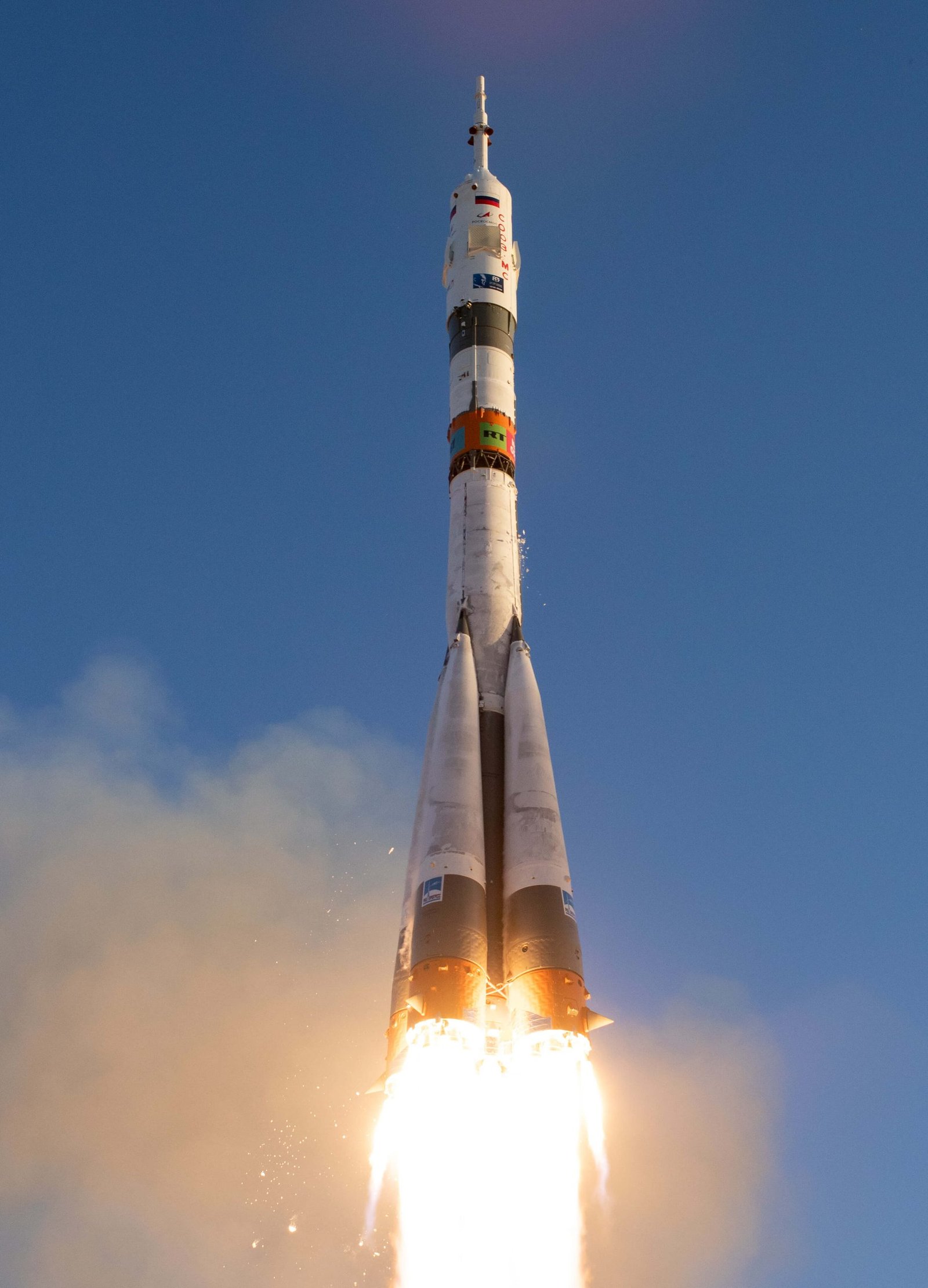 A Soyuz-2.1b rocket carrying a satellite payload launches from a Russian space facility.
