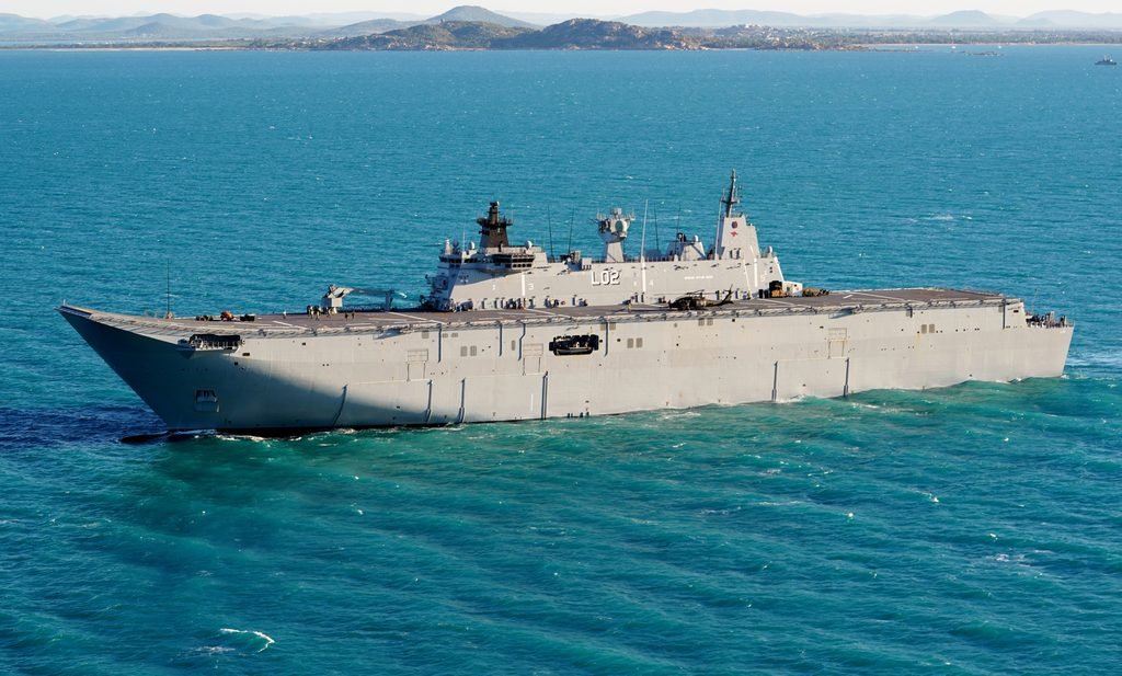 The Royal Australian Navy landing helicopter dock HMAS Canberra conducting joint maritime operations in the Pacific Ocean.