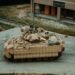 A U.S. Army M2A4 Bradley infantry fighting vehicle maneuvering during testing exercises.