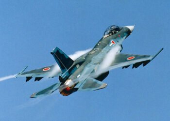 A Japanese F-2 fighter jet equipped with a large supersonic ASM-3 missile on the wing pylon.
