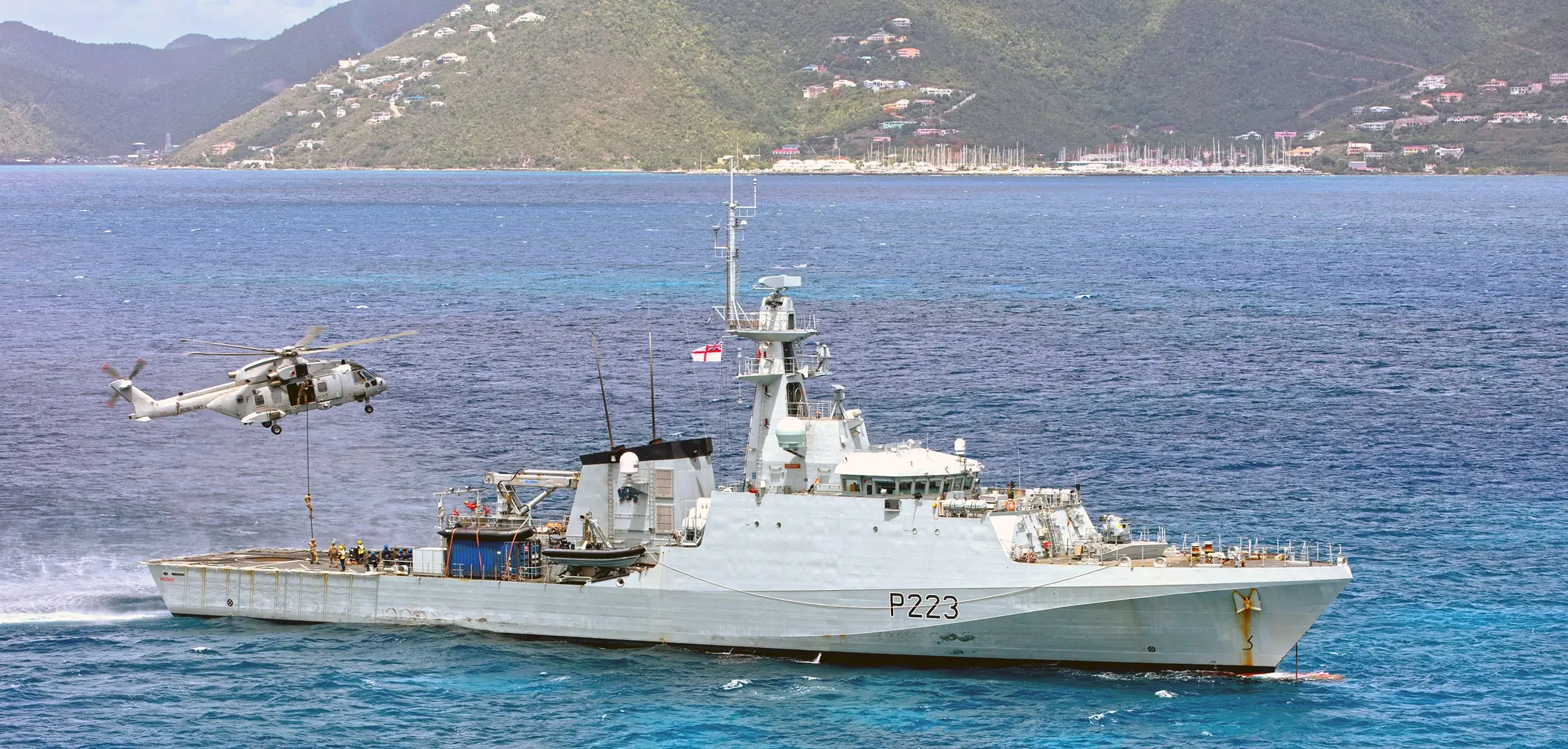 Medway conducting an exercise with a Merlin HC4 from 845 Naval Air Squadron off the coast of Curaçao.