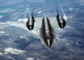 An air-to-air overhead front view of an SR-71A strategic reconnaissance aircraft. The SR-71 is unofficially known as the "Blackbird."