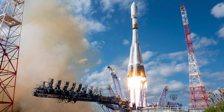 A Soyuz-2.1b rocket carrying a satellite payload launches from a Russian space facility.