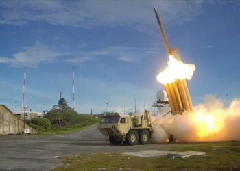 Terminal High Altitude Area Defense (THAAD) surface-to-air missile launching during a high-intensity air defense intercept maneuver.