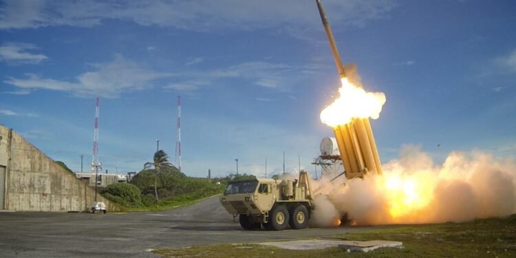 Terminal High Altitude Area Defense (THAAD) surface-to-air missile launching during a high-intensity air defense intercept maneuver.