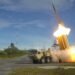 Terminal High Altitude Area Defense (THAAD) surface-to-air missile launching during a high-intensity air defense intercept maneuver.