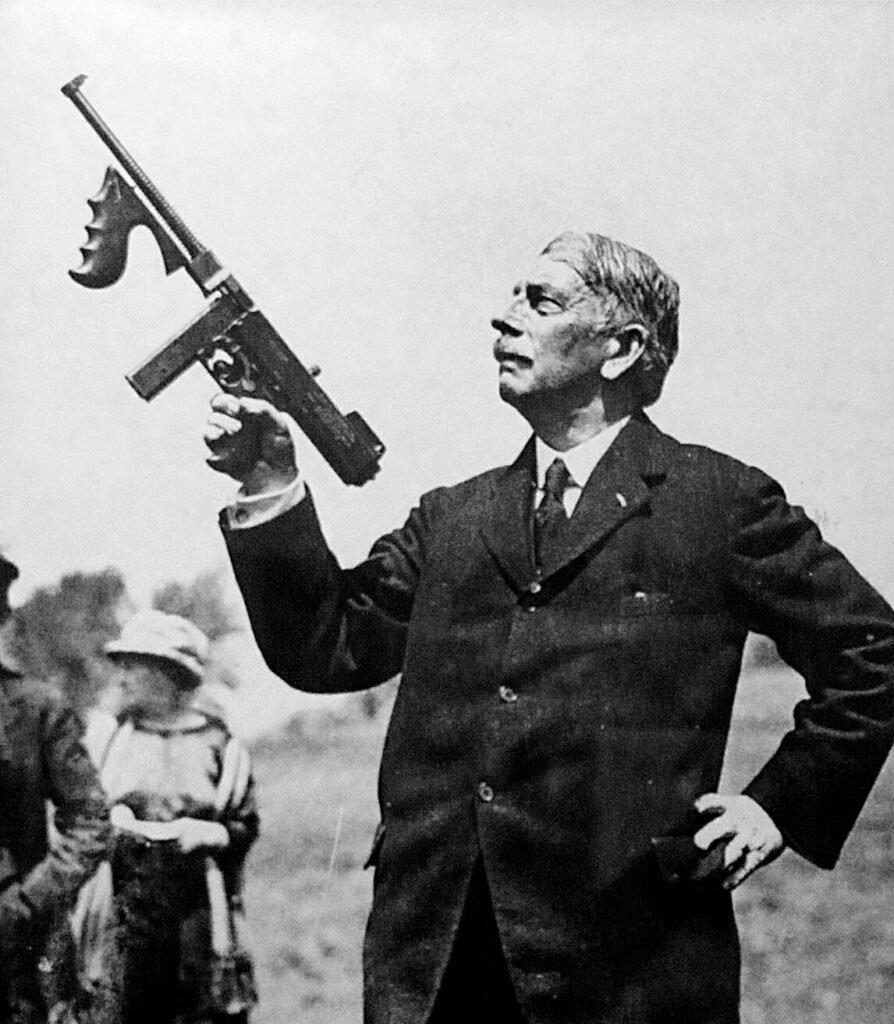 Brigadier General John T. Thompson holding a Model 1919 Thompson
