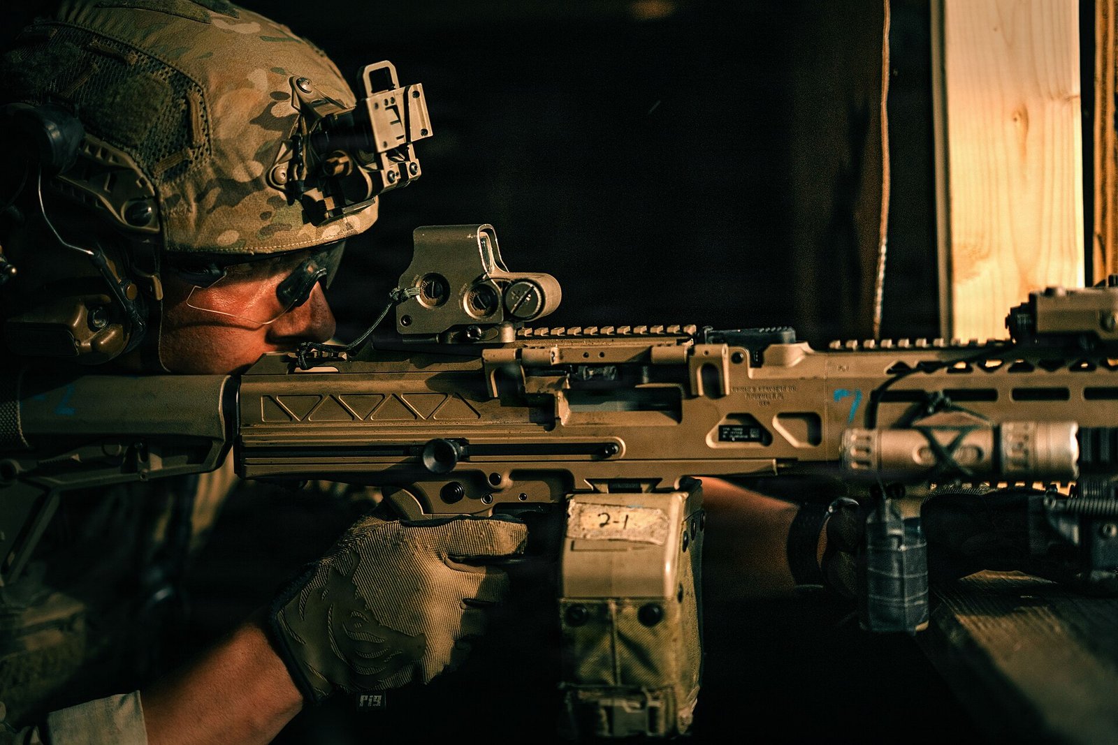 U.S. Army Ranger with 3rd Battalion, 75th Ranger Regiment, firing a KAC LAMG