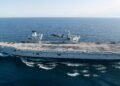 An image of HMS Prince of Wales and f35b lightining 2 taking off from it.