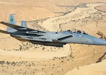 An advanced RSAF F-15SA Strike Eagle fighter jet equipped with precision-guided munitions