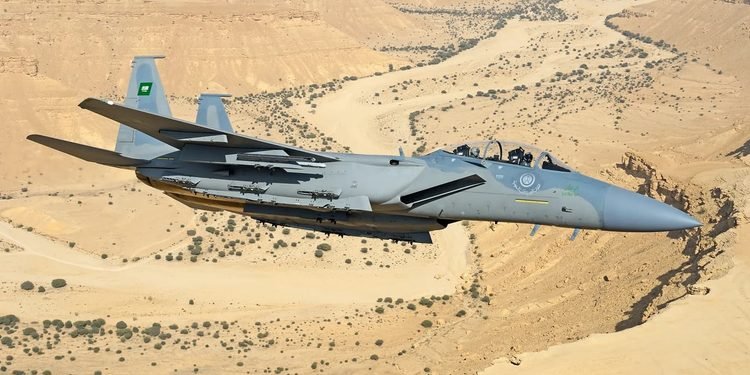 An advanced RSAF F-15SA Strike Eagle fighter jet equipped with precision-guided munitions