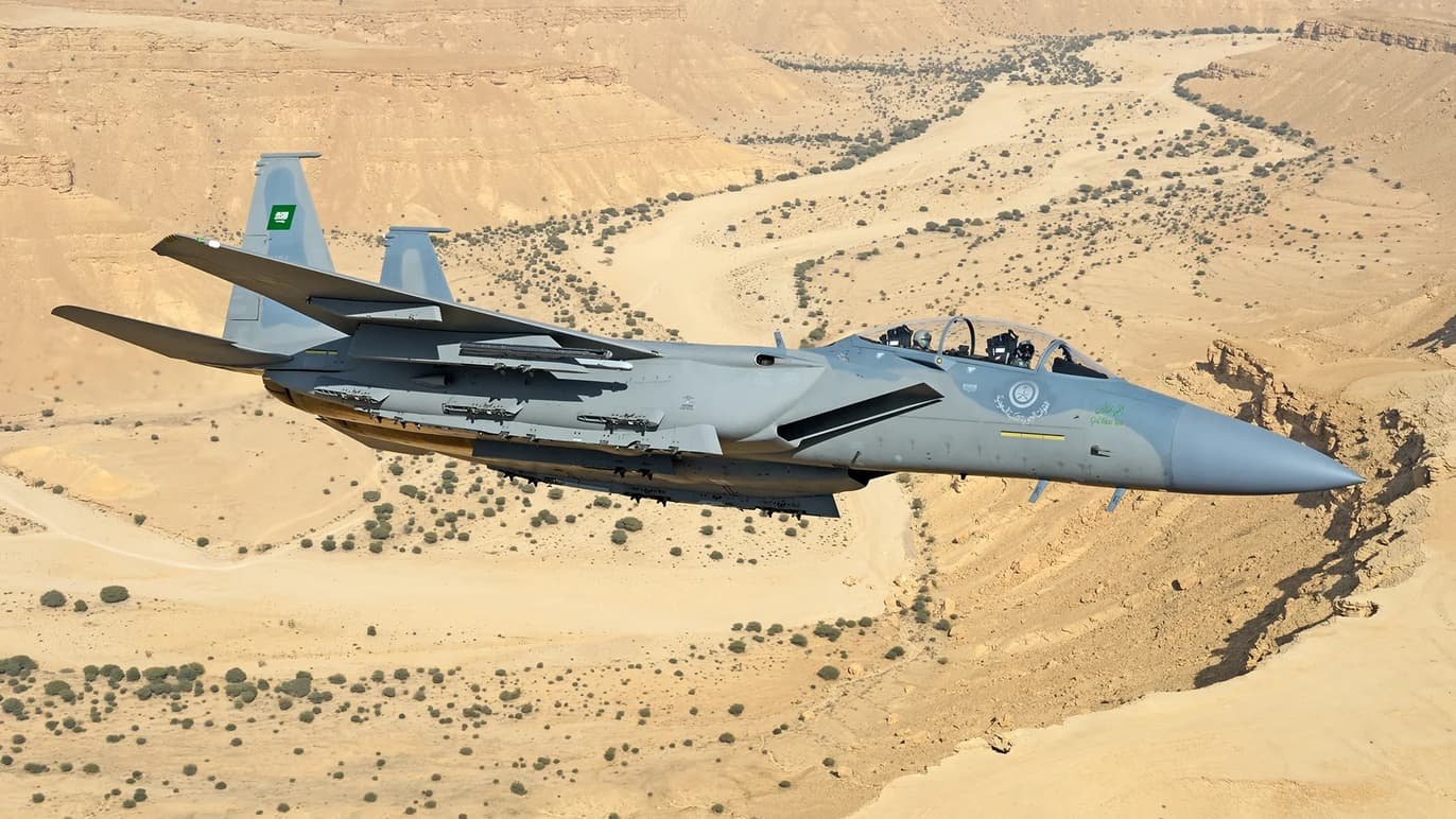 An advanced RSAF F-15SA Strike Eagle fighter jet equipped with precision-guided munitions